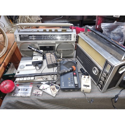 1010 - A collection of four retro radio / stereos and a cassette tape player. Prevuiously in auction, 24/3 ... 