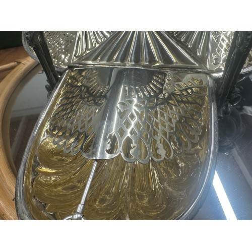 992 - Star Lot: A late Victorian silver plated EPNS triple wing muffin warmer. A very impressive centre pi... 