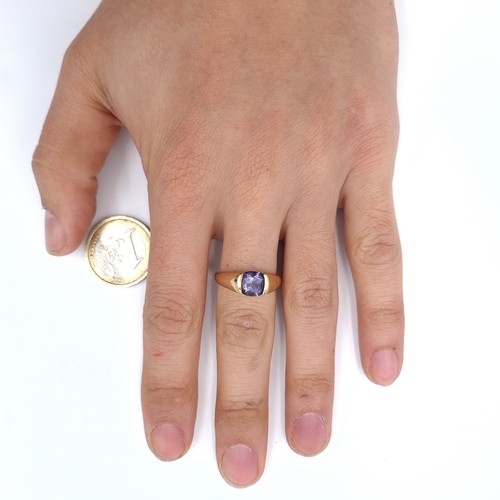 906 - Star Lot: A nine carat gold (375) wide band gold ring set with a bright Amethyst stone. Size - N. We... 