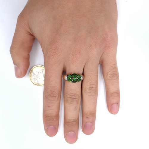 910 - Star Lot: A green tourmaline stone ring with diamond mount set in nine carat gold marked China. Size... 