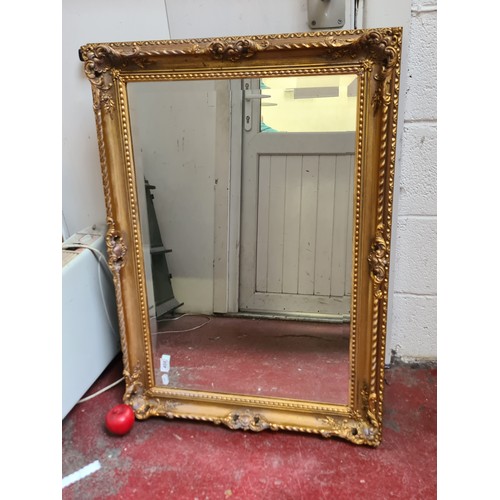 1021 - Star Lot : A lovely large antique  Gilt over mantle bevelled mirror in the empire style. Heavy very ... 