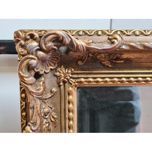 1021 - Star Lot : A lovely large antique  Gilt over mantle bevelled mirror in the empire style. Heavy very ... 