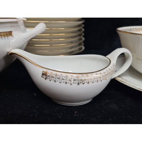 927 - A Lovely large dinner set by Emaux Dd Limoges, With lovely white porcelain and gold detail. Will put... 