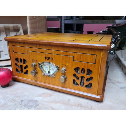 933 - A stylish Itek Nostalgic Music System, featuring a wood finish, turntable, CD player, and radio capa... 