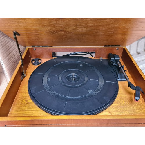 933 - A stylish Itek Nostalgic Music System, featuring a wood finish, turntable, CD player, and radio capa... 