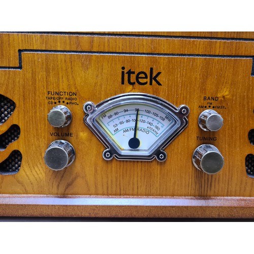 933 - A stylish Itek Nostalgic Music System, featuring a wood finish, turntable, CD player, and radio capa... 