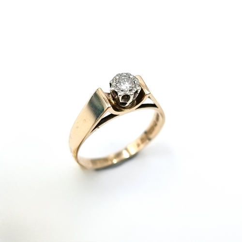 11 - Star Lot : A nine carat gold (375) wide band illusion set solitaire diamond ring. Ring size - P. Wei... 