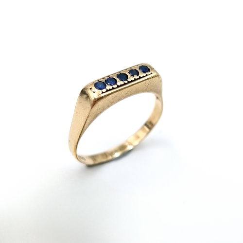 12 - A nine carat gold (375) five stone channel set Sapphire ring. Ring size - P. Weight - 1.97 grams. Bo... 