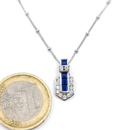 19 - Star Lot : A very pretty 9ct white gold art deco style Sapphire pendant with attractive bright cut 9... 