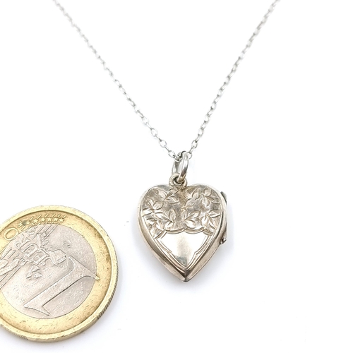 20 - A pretty vintage Birmingham hallmarked silver locket pendant with foliette detailing and chain. Leng... 