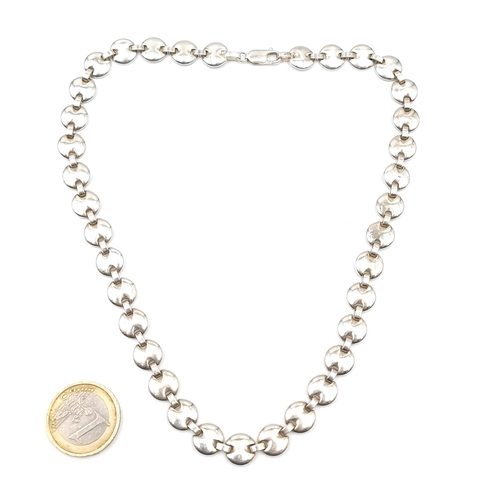 22 - A nice example of a sterling silver disc link necklace. Length of necklace - 40 cms. Weight - 44.20 ... 