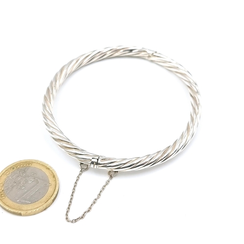 24 - A pretty sterling silver cable link style silver bracelet set with safety chain. Weight - 12 grams. ... 