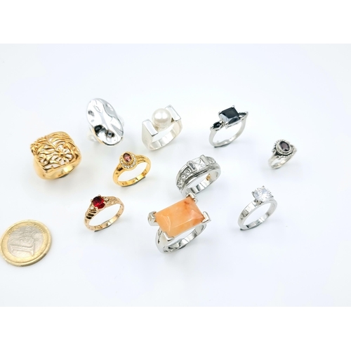 31 - A collection of ten rings. Mostly gem set examples. Ring sizes: Q - V. Total weight of rings - 61.84... 