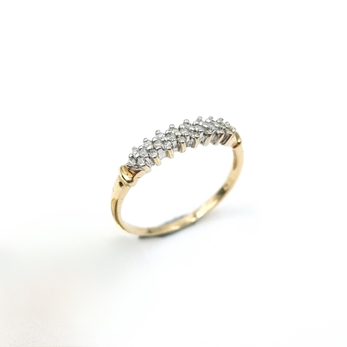 5 - Star Lot : A beautiful example of a diamond half eternity ring set in nine carat gold. Ring size - T... 