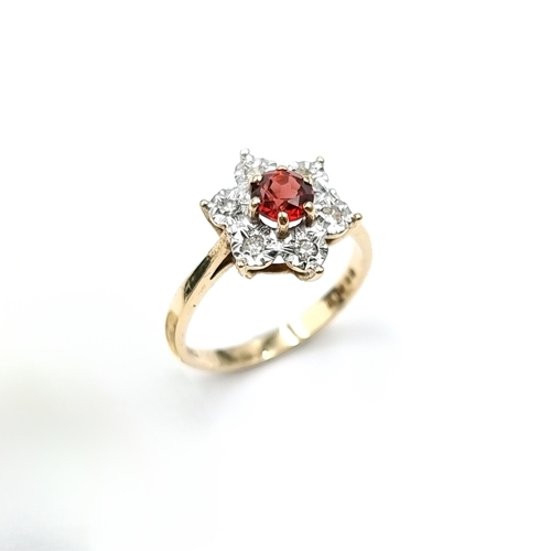 6 - Star Lot : An attractive star design diamond cluster ring set with garnet stone mounted in nine cara... 