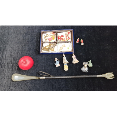 150 - A selection of vintage miniatures and charms. Inc silver charm, Along with decorative back scratcher... 