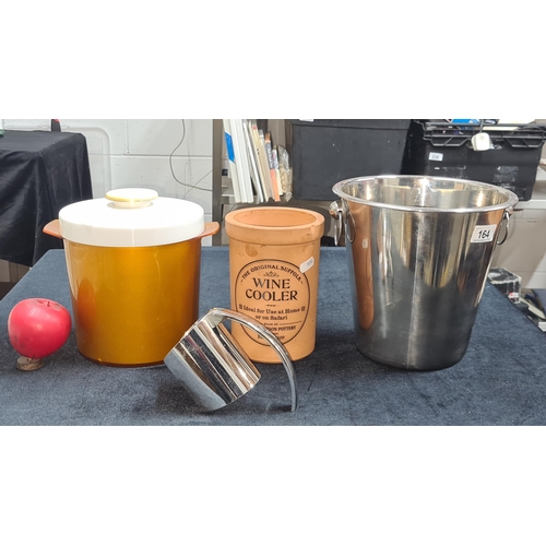 164 - Two ice buckets including a stainless ice bucket and vintage ice bucket and a  ceramic wine cooler .