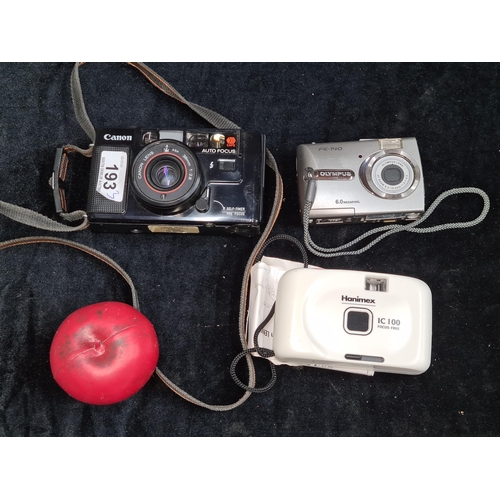 193 - Three film cameras including two analog 35mm cameras, one canon auto focus 35mm example and an Olymp... 