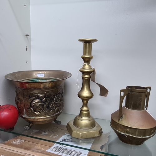 208 - A lot of three brass items including an antique Irish made brass pot with claw feet and a tall candl... 