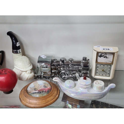 218 - Five items including a fabulous Avon bulldog pipe, a cruet set and Friger clock and a silver coloure... 