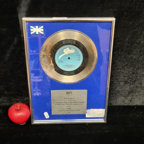 77 - A fabulous music memorabilia silver single record featuring Eurovision Legend Johnny Logan 'What's A... 