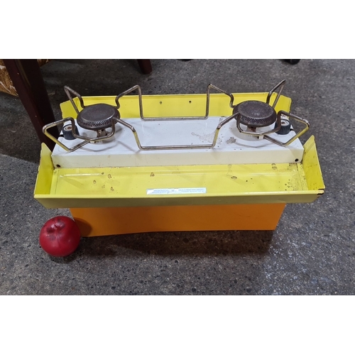 A vintage Primus 2222 Double Burner Camping Stove Orange