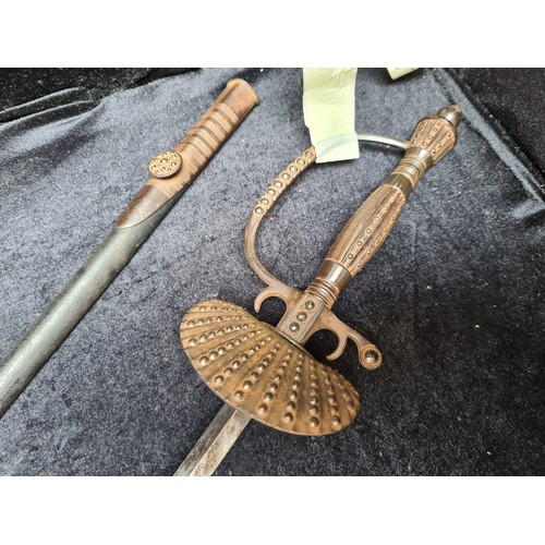 1428 - Star Lot: An early Victorian sword with fastened decoration. In very good condition. Complete in und... 