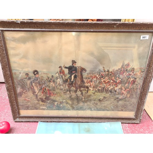 A large chromolithograph print of an original painting titled 'What will they say of this in England?' by Hillingford Robert Alexander. Features the Wellington galvanising his troops at Waterloo just before the arrival of a French attack. Housed in a decorative carved wooden frame behind glass. Along with a large chromolithograph print after an original painting titled 'The Last shot at Colenso.' by R Caton Woodville, 1900.