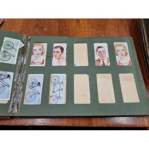 153 - Four fairly full fabulous vintage cigarette picture albums. Albums feature brands such as Players an... 