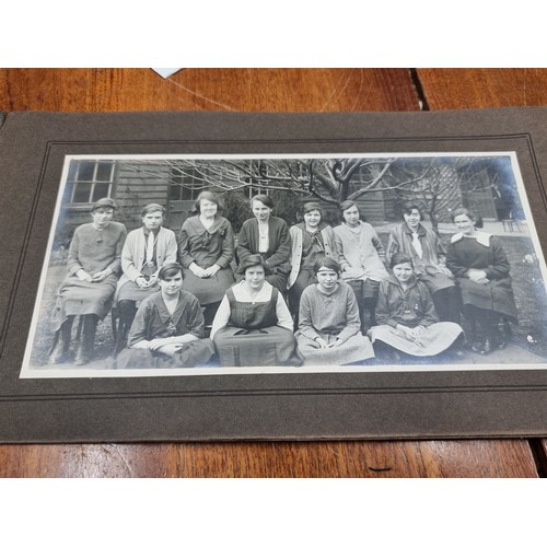 172 - An intriguing early-mid 20th century photographic souvenir album containing images of past pupils an... 