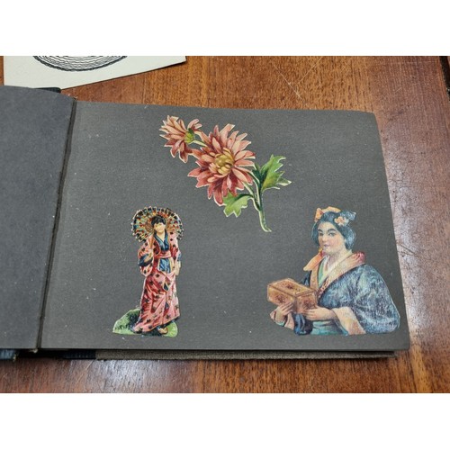 169 - Two small antique decoupage scrap books  / albums filled with lovely imagery of flowers, birds and c... 