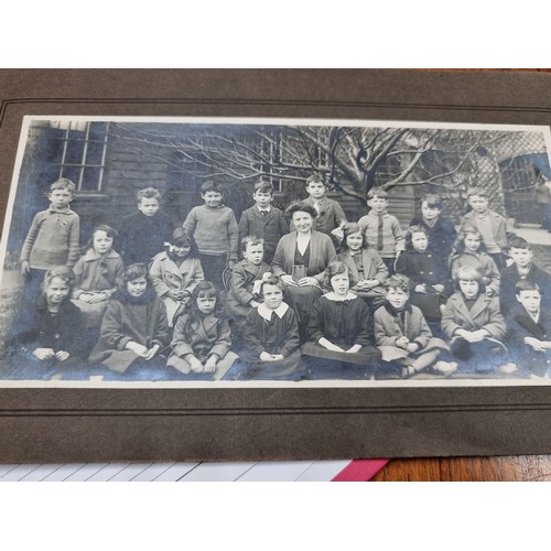 172 - An intriguing early-mid 20th century photographic souvenir album containing images of past pupils an... 