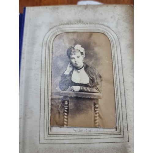 170 - Star Lot : An antique 189th century leather bound photo album, featuring a wide variety of portraits... 