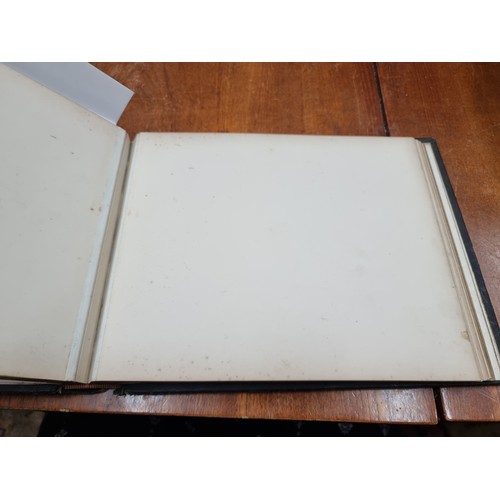 178 - A fabulous leather bound scrapbook comprising of several pages of prints and imagery. Album cover fe... 