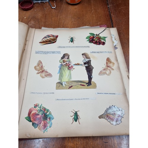 176 - Two fabulous antique decoupage scrapbooks, one dated 1872 consisting of Victorian imagery, prints an... 