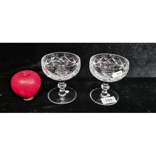 109 - A pair of fab Waterford Crystal champagne coupes. Both in good condition with acid marks to base.