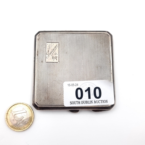 10 - A sterling silver powder compact Hallmarked Birmingham (Date - 1946) with machine cut detailing. Tot... 