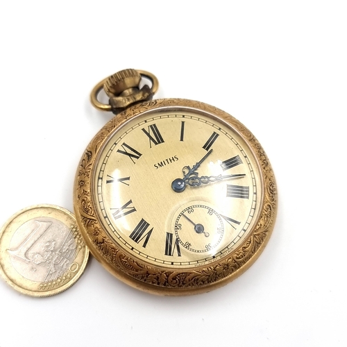 17 - A gold toned Smiths  top wind pocket watch with gold face and black roman numeral figures. Watch has... 