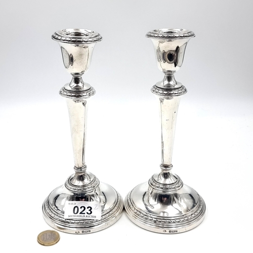 23 - A pair of lovey sterling silver candle sticks. Hallmarked Birmingham dated - 1960. Bases - 9 cms dia... 