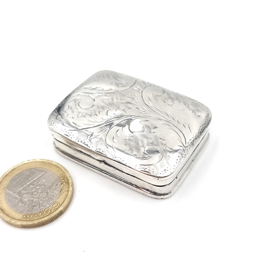 28 - A sterling silver snuff box with hinged lid an attractive foliate design. Dimensions - 4.5 x 3.5 cms... 