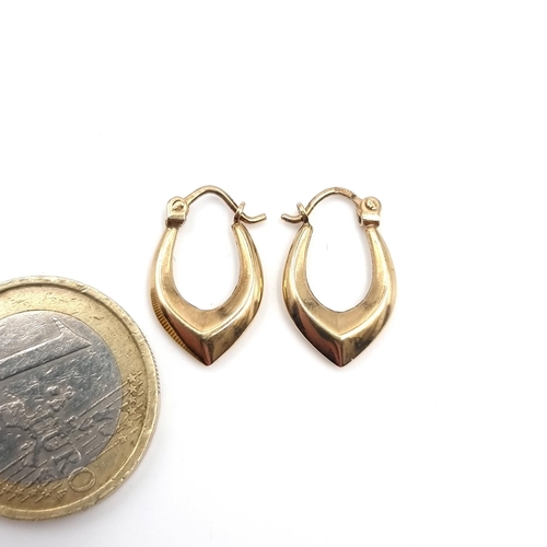 43 - A pair of nine carat gold hoop earrings suitable for pierced ears. Weight - 0.88 grams.