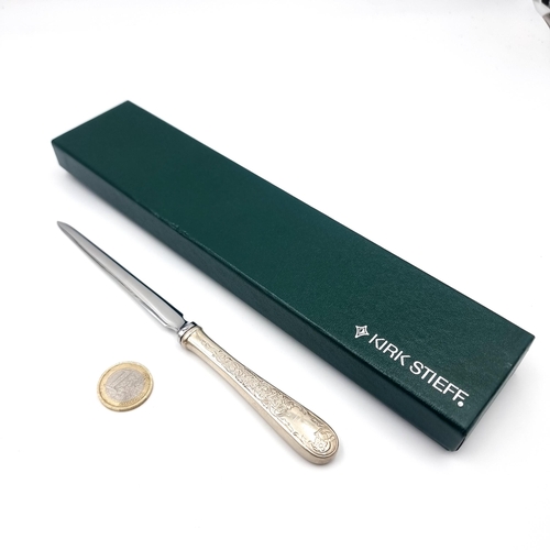 44 - A sterling silver handle letter opener with attractive floral and foliette detailing. Length - 19 cm... 