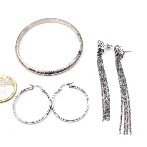 53 - A collection of silver items consisting of a silver bracelet, together with a pair of circular silve... 