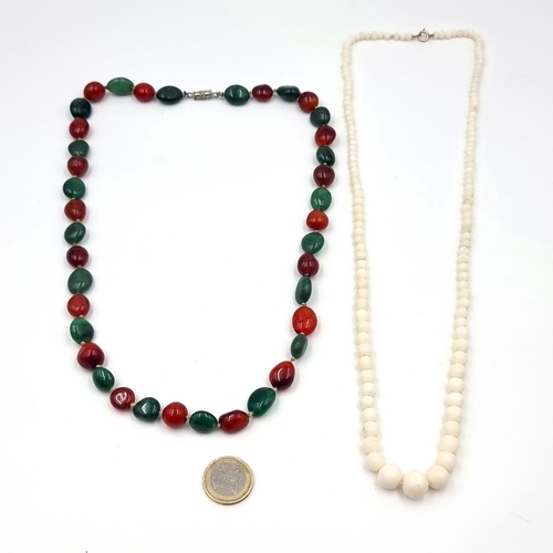 55 - Two polished stone beaded necklaces. One a graduated stone example. Length - 64 cms. Weight - 42.09 ... 