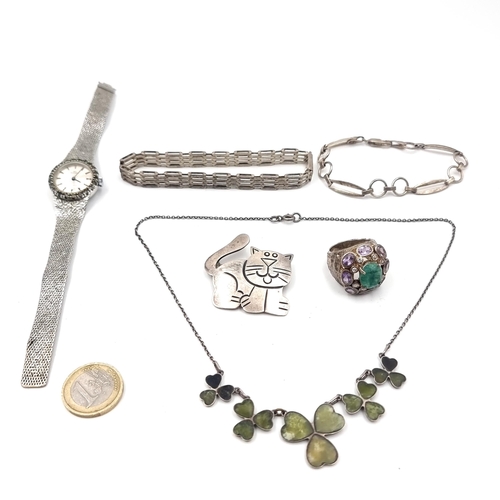 57 - A collection of items consisting of a silver gate bracelet together with a further link design brace... 