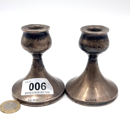 6 - A pair of sterling silver candle holders hallmarked Birmingham - 1960. Total weight - 213 grams. (fi... 