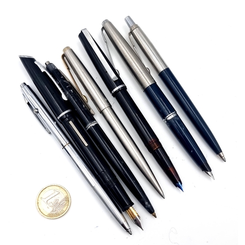 9 - A collection of pens consisting of a Parker fountain pen., two Parker ball point pens and a black pl... 