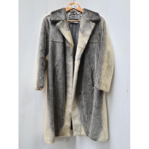 376 - Star Lot  : An unusual and stylish vintage fur coat in a black and white shade from Lichtblau. Appro... 