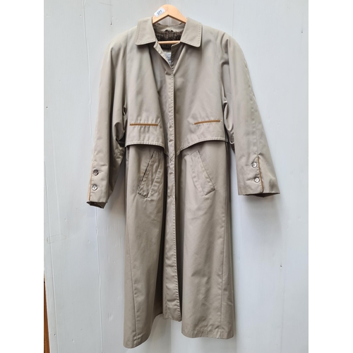 377 - Star Lot : A sleek Dolce & Gabbana designer trench coat, crafted from a breathable mesh. Top Italian... 