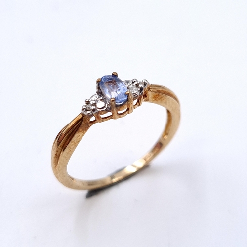 924 - Star Lot : A stunning diamond and tanzanite 10 carat gold ring. Ring size - O. Weight - 1.50 grams. ... 